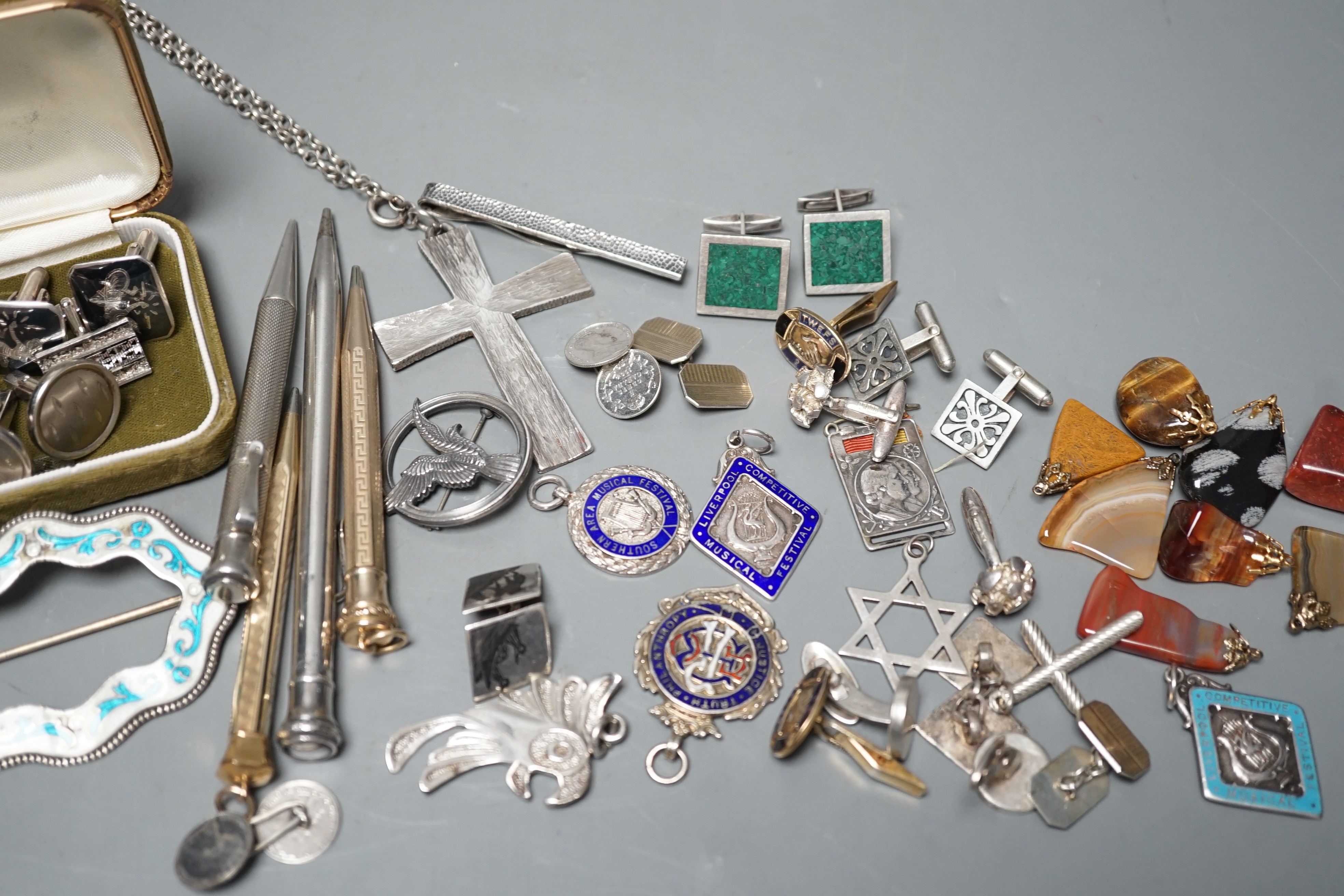 A white gold two colour enamel and diamond chip set Royal Artillery sweethearts brooch